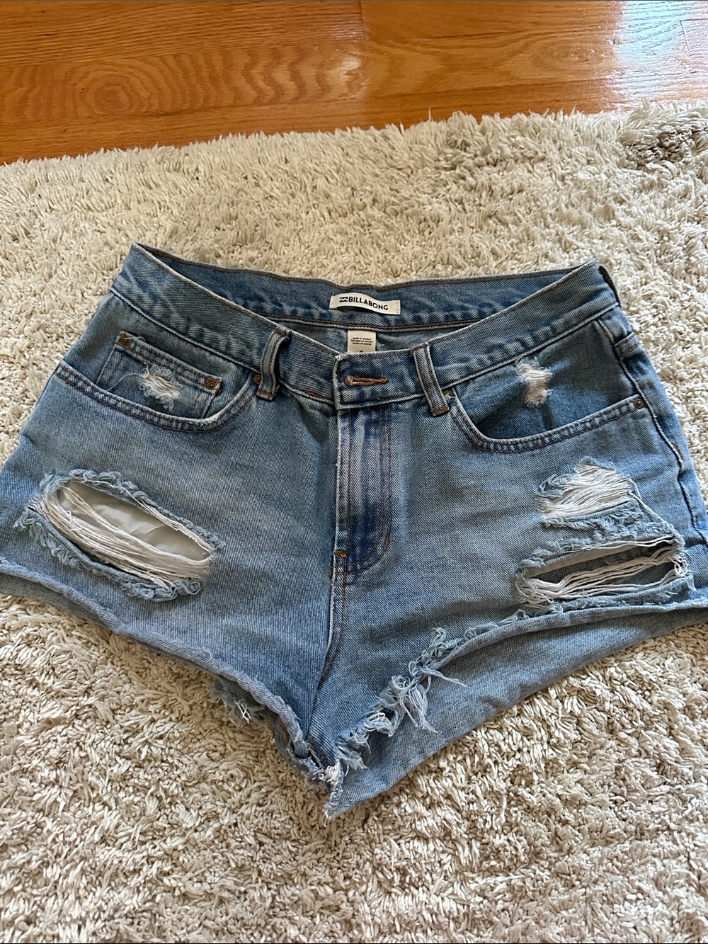 Billabong Women's Light Blue Distressed Denim Cutoff Shorts - mid-rise
